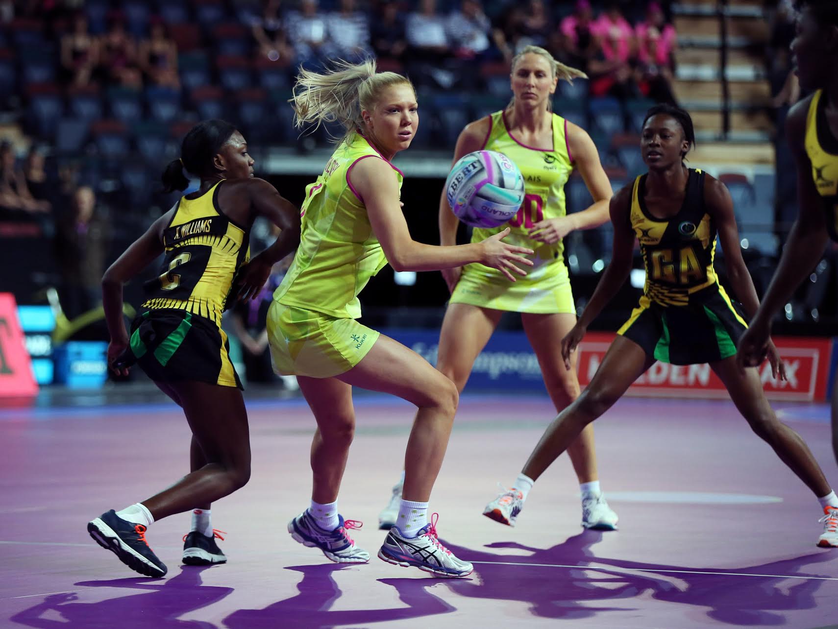 08.11.2014 Australia's Kate Moloney in action during the netball match between Australia and Jamaica at the Fast5 Netball World Series at Vector Arena in Auckland. Mandatory Photo Credit ©Michael Bradley.